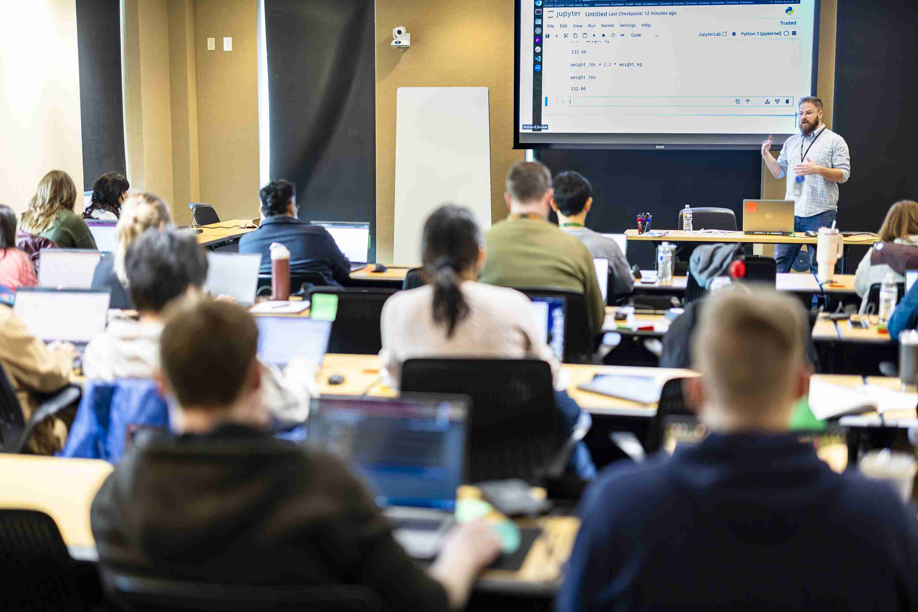Picture of instructor live coding with students
